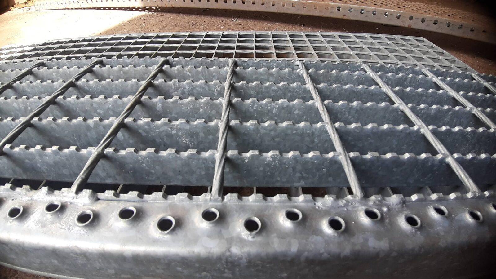 Serrated stair tread with a perforated nosing