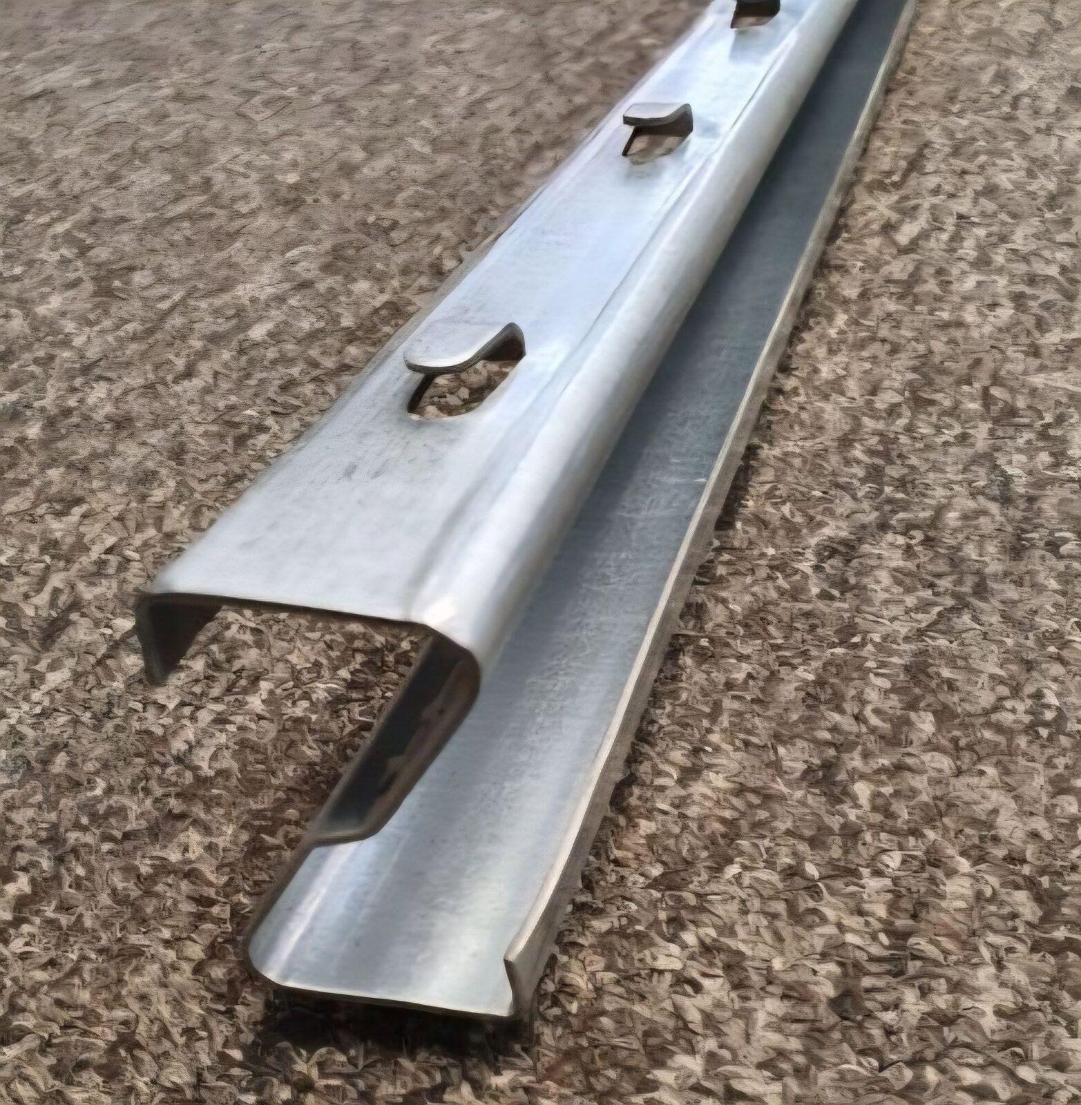 Galvanized crash barrier profile with fixing points