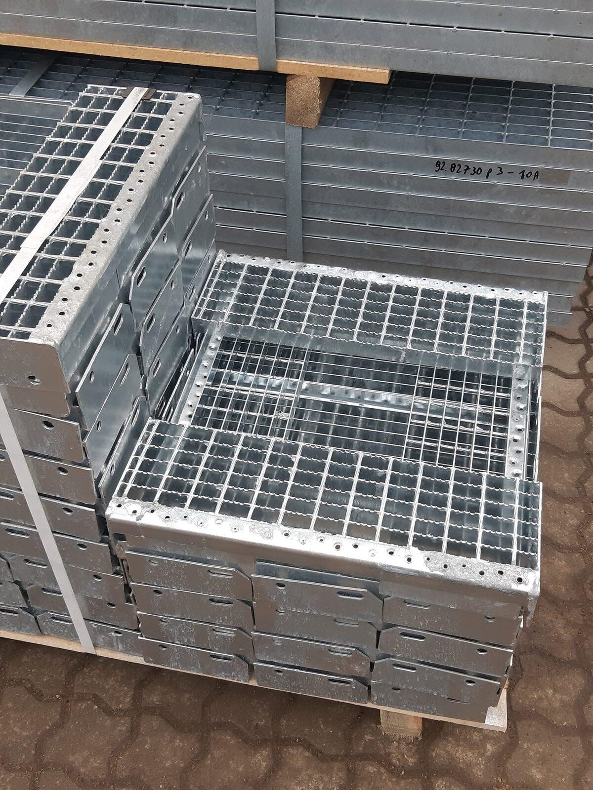 Galvanized stair treads stacked on a pallet
